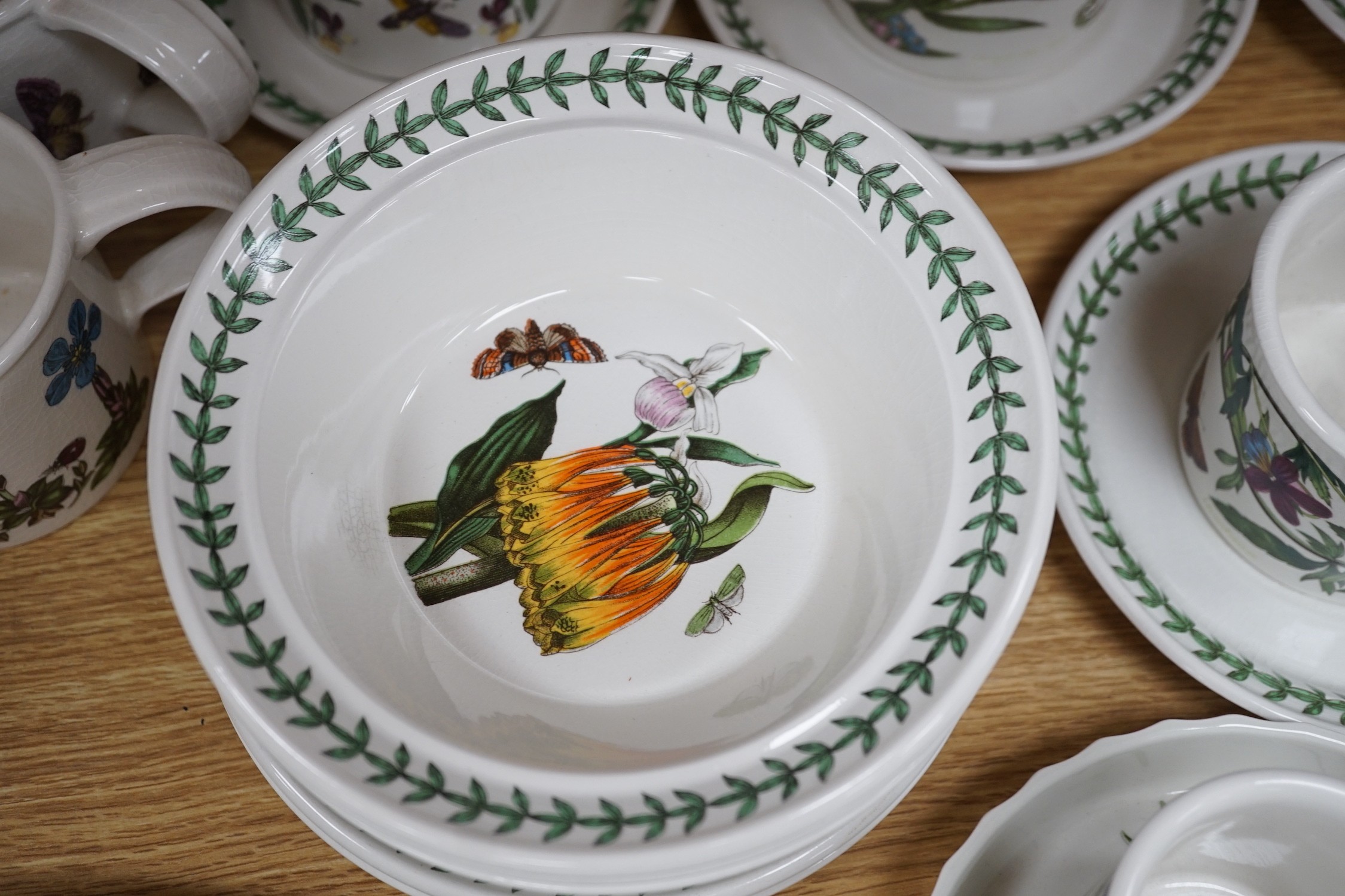 A mixed Portmerion dinner service- a biscuit jar and cover, tureens, serving dishes, teapot etc